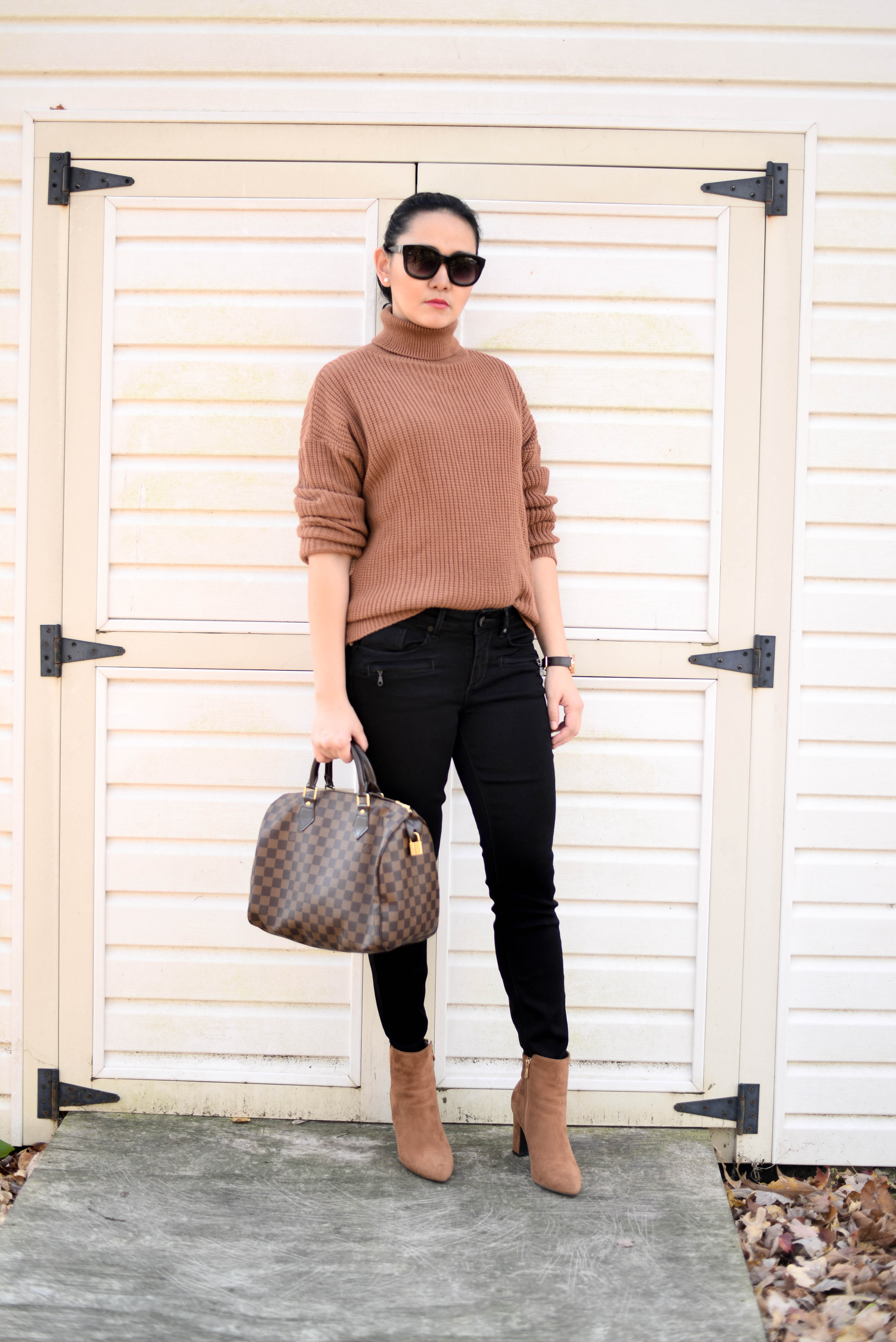 black pants and sweater outfit